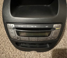 Toyota Aygo mk1 Radio- Cd player stereo, and a piece of trim middle dash pocket